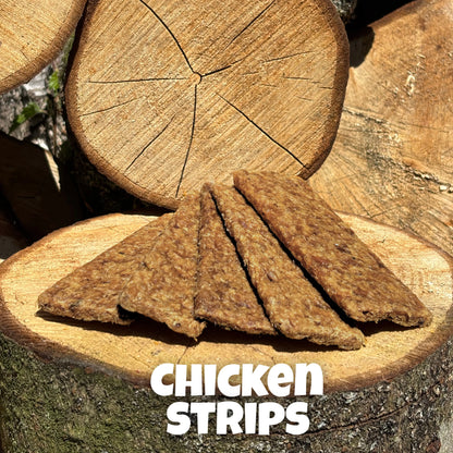 Natural dog treats – air-dried chicken strips with a soft, chewy texture, displayed on wooden logs, ideal for dogs of all sizes and ages.