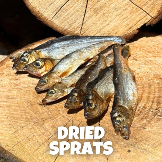 Natural dog treats – air-dried Baltic sprats laid on rustic wooden logs, omega-rich fish chews that support healthy skin, coat, joints, and overall well-being. Hypoallergenic and perfect for dogs of all sizes.